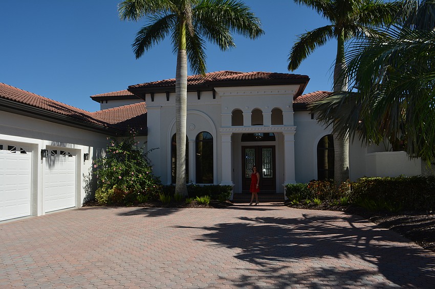 The exterior of the home at 6809 Belmont Court was painted lighter colors to leave the Mediterranean design behind.