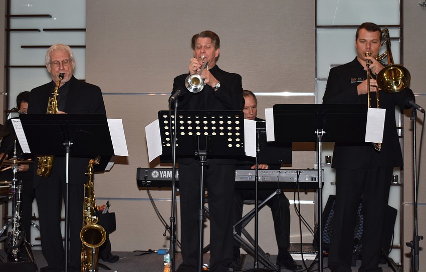 The John Miller Jazz Ensemble performs for guests.