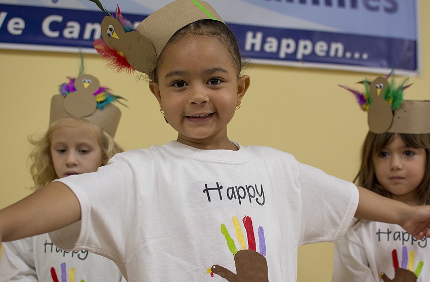 Senya Webb poses before performing for Temple Emanu-El preschool parents and staff.