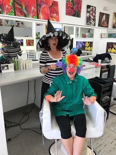 Irina LaRose tries to tame Sue Reese&#39;s clown hair. Photo courtesy of Sue Reese