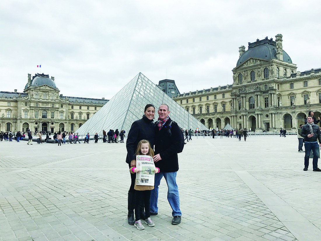 Shannon, Jason and Hannah Fimple stand  outside of the Louvre Museum in Paris. They won this year&#39;s It&#39;s Read Everywhere contest.