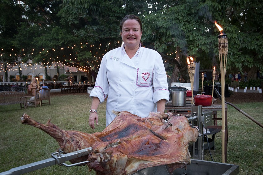 Chef Anna Ridgewell of Londolozi Game Reserve cooks dinner at the Bush Dinner on Nov. 3 at Marie Selby Botanical Gardens. Photo courtesy of the Klaubers