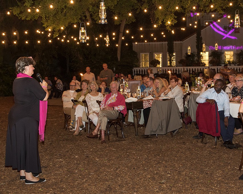 Kate Groch, CEO of Good Work Foundation, addresses the crowd at the Bush Dinner on Nov. 3 at Marie Selby Botanical Gardens. Photo courtesy of the Klaubers