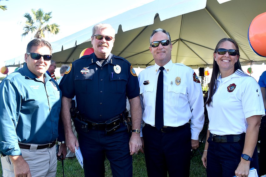 Longboat Key Police Department Deputy Police Chief Frank Rubino and Chief Pete Cumming with Longboat Key Fire Rescue Chief Paul Dezzi and Tina Adams