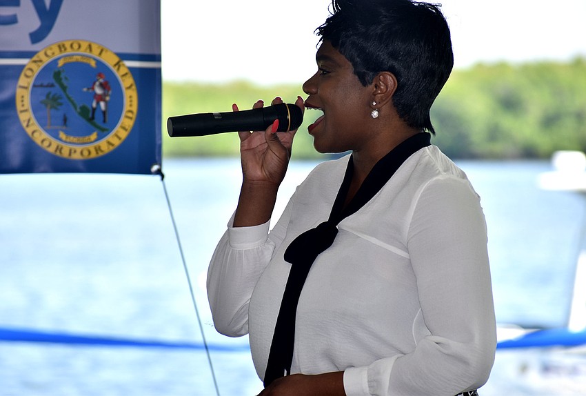 Shantel Norman sings the national anthem.