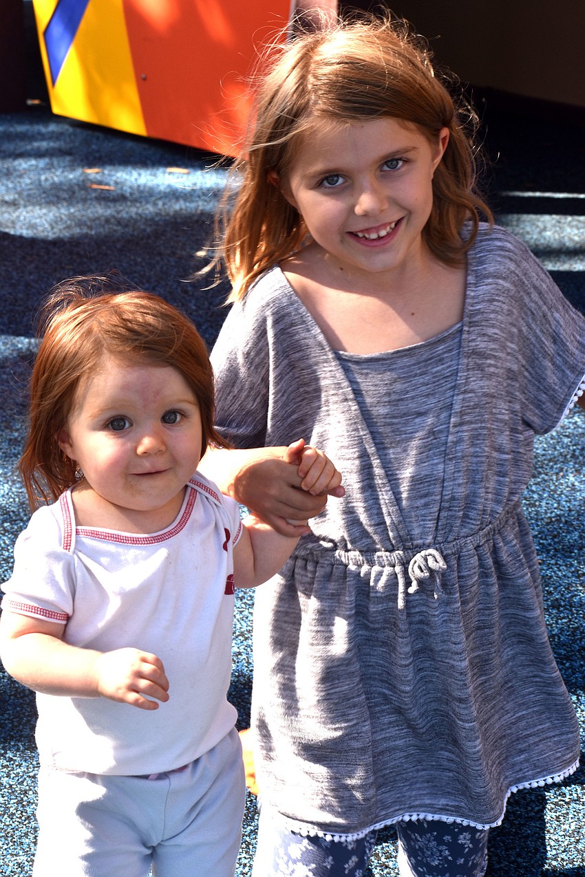 Lily and Leah Hass check out the children’s playground at Bayfront Park.