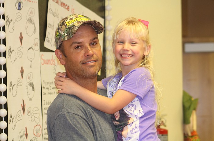 Wesley Haney and his daughter, Audrey, enjoy Braden River Elementary's "Fall-ing into Literacy."