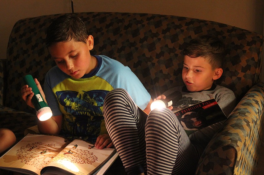 Braden River Elementary third-graders Dylan Meeks and Jonathan Lopez put the spotlight on reading.
