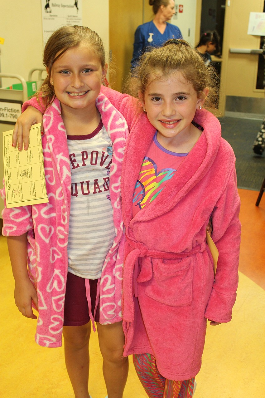 Braden River Elementary fourth-graders Jessica Mowrey and Isabella Juliano have worn the same robes to events since they were in kindergarten.