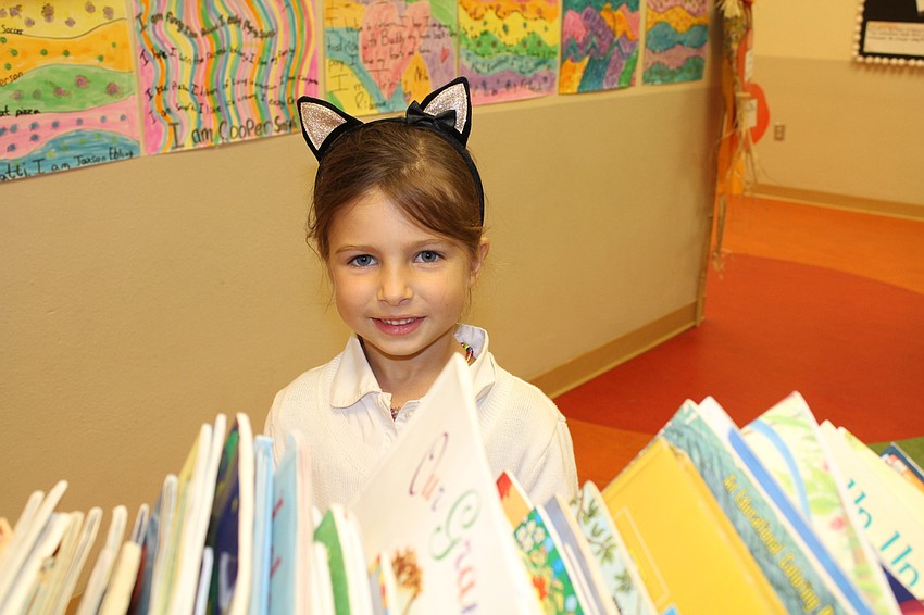 Kindergarten student Mikenna Yermak looks for a good book.