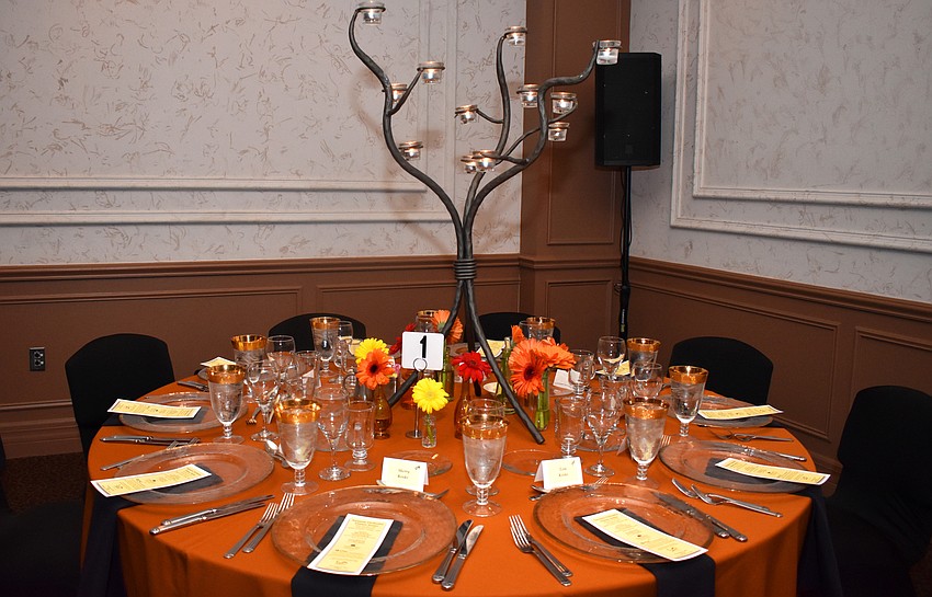 Dinner was moved to the Michael’s On East ballroom when 103 guests came through the door, making Michael’s Wine Cellar more crowded than expected.