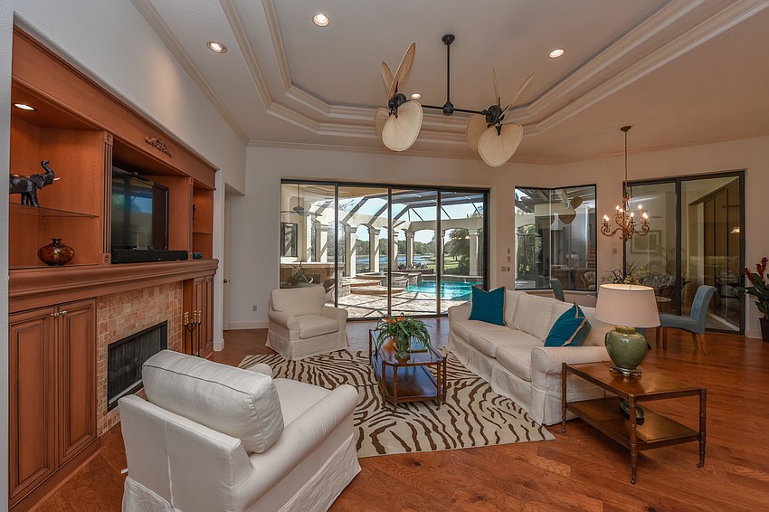 The former look had the darker wood and fireplace.