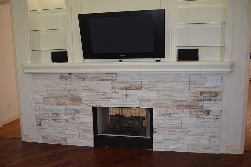 The two-way fireplace received the lighter, brighter treatment.