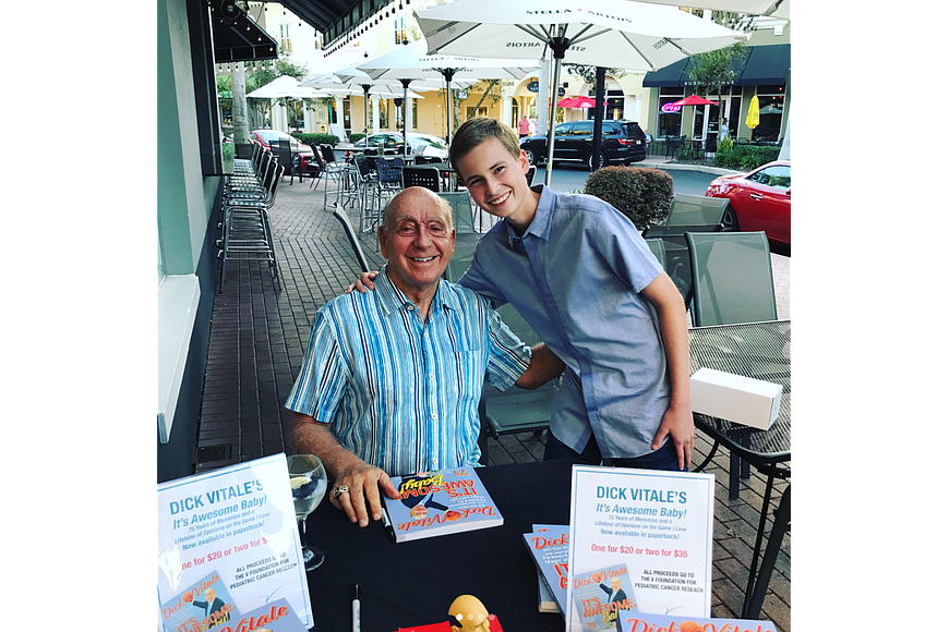 Dick Vitale takes a picture with cancer survivor Cole Eicher. (Courtesy image).