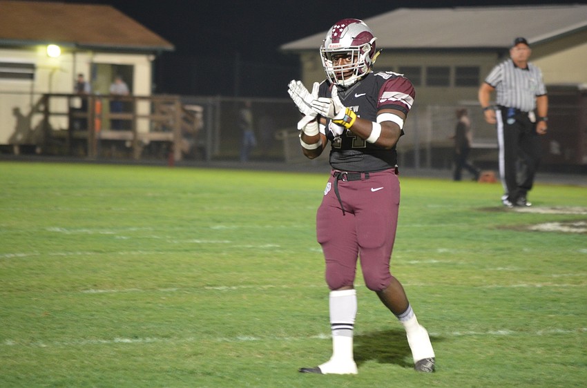 Defensiveback Jay Turner claps after a Rams stop. Riverview's defense held Gateway to two touchdowns in the lopsided win.