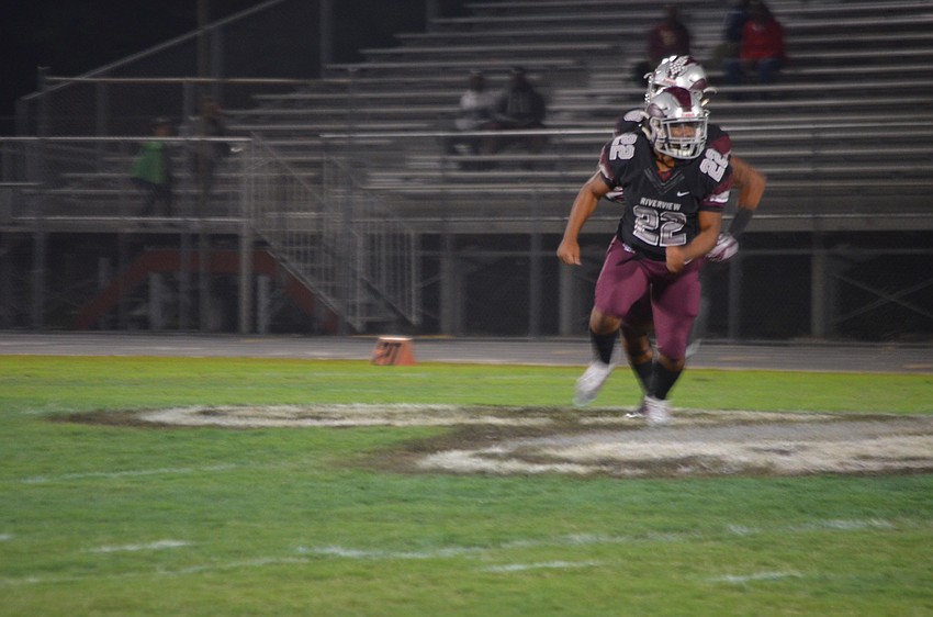 Ali Boyce looks to spring a block for ball carrier Arthur Brantley.