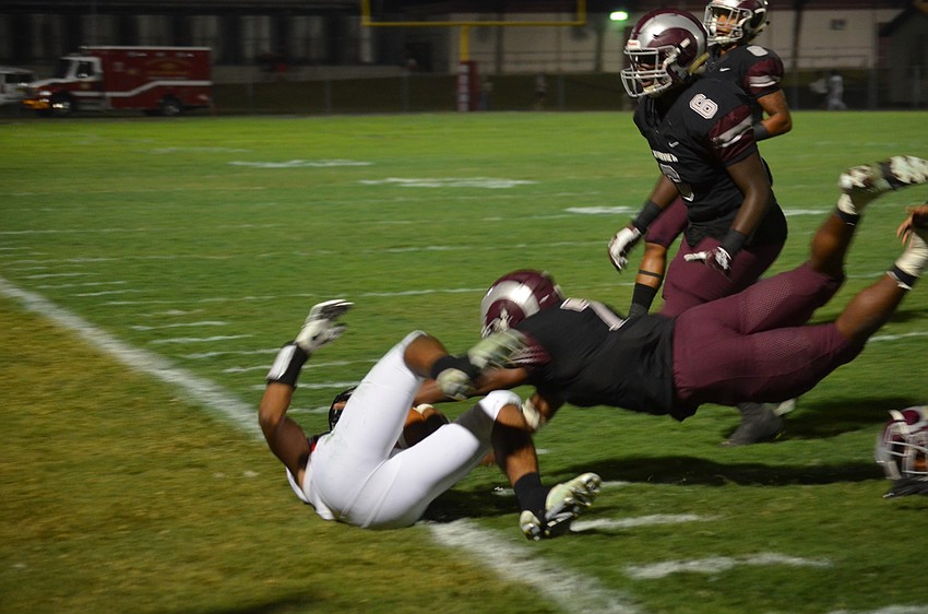 Antrone Thomas dives for a tackle.