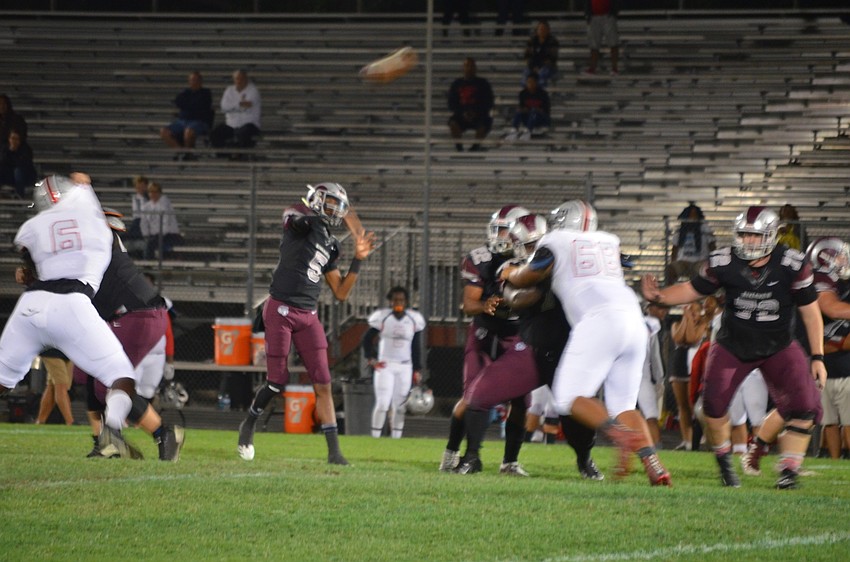 Arthur Brantley delivers a deep pass. He threw two touchdown passes and rushed for another.