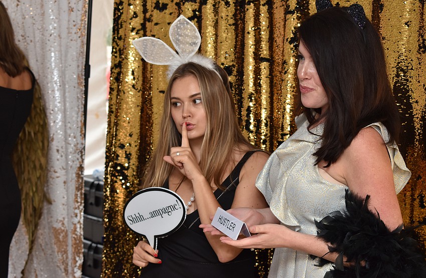 Alexandra Settlemyer and Lauren Jones pose in the photo booth.