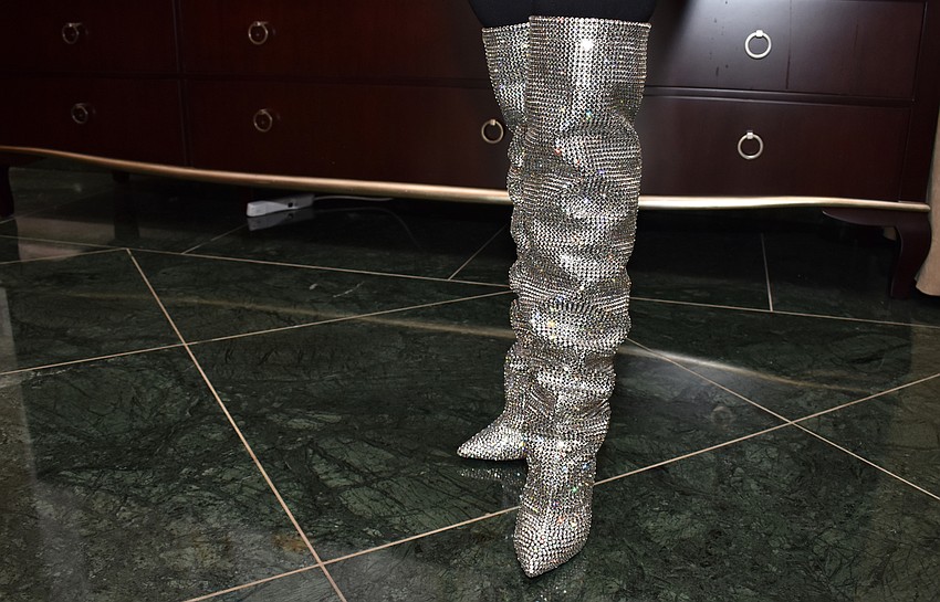 Janelle Beruff shows off her shoes, which won the best boots award.