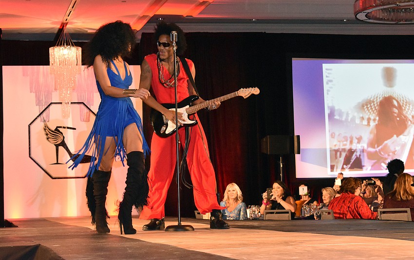 Models interacted with performers in a lively fashion show by The Met.