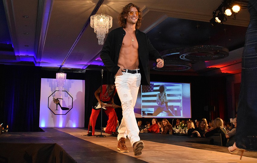 Models strut the runway during a lively fashion show by The Met.