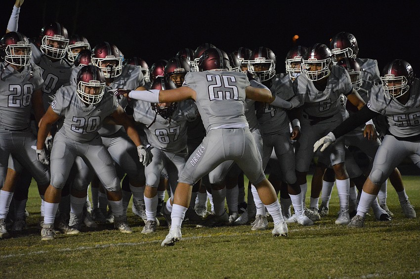 Braden River senior Chase Knopf (25) fires up the Pirates before the game.