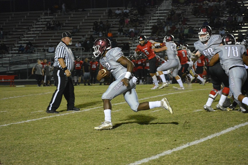 Senior Deshaun Fenwick rampages through the Wolfpack defense. He took this carry 76 yards for a touchdown.