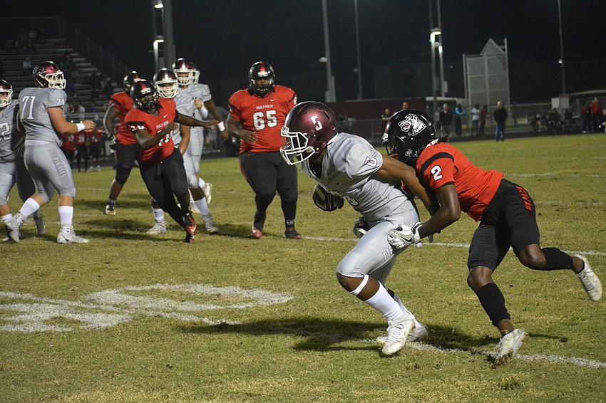 Junior wideout Daveon Wortham shakes off a Wolfpack cornerback and heads upfield.