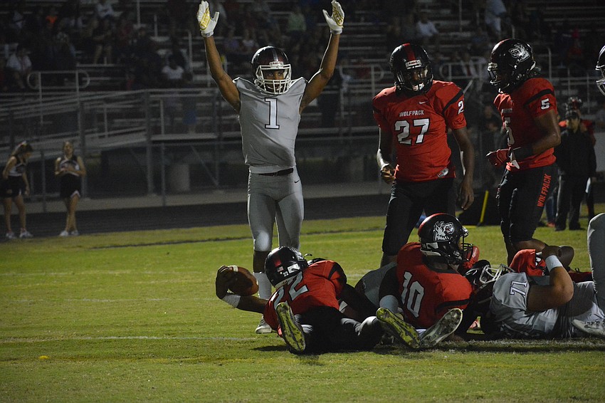 Senior wideout Craivon Koonce (1) signals 
