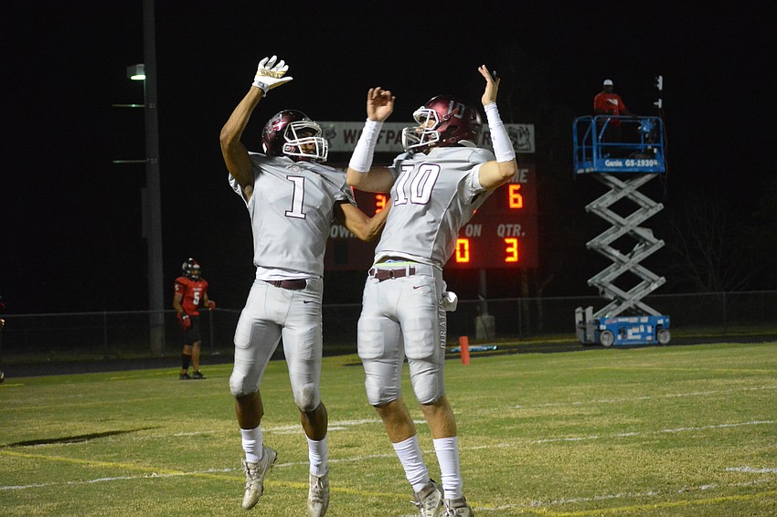 Craivon Koonce and Bryan Gagg jump in celebration after the pair connected on a long touchdown pass.