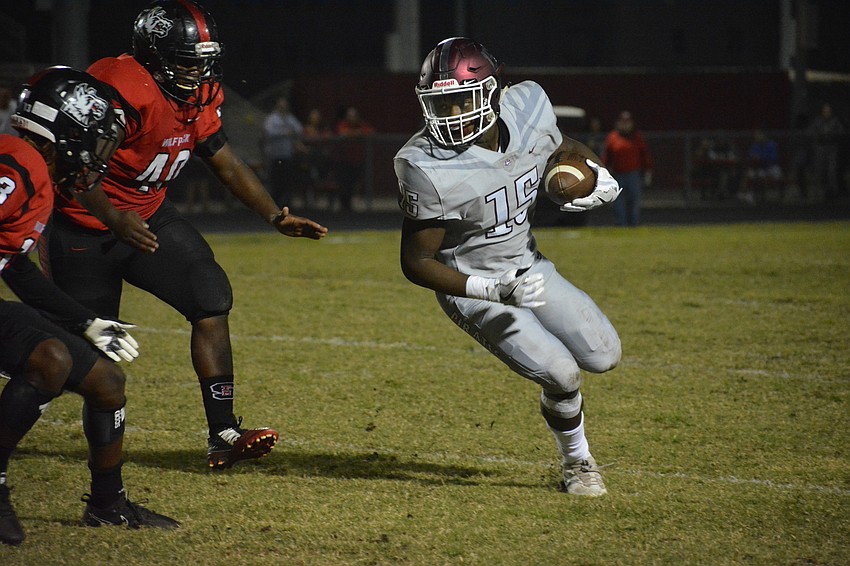 Knowledge McDaniel looks for a defender to shoulder out of his way.