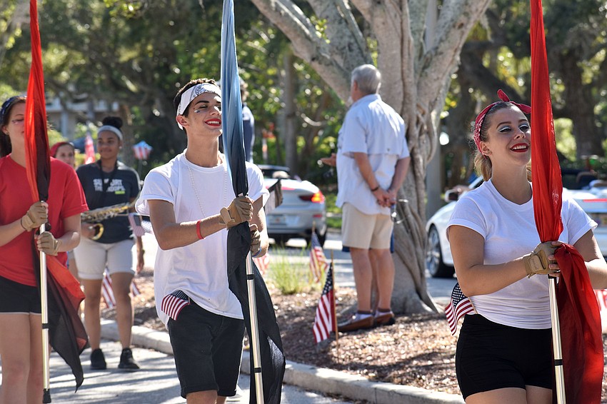 Flag twirlers from the Booker High School Marching Band, The Whirlwind Brigade,  performed during the fourth annual Longboat Key Veterans Day Parade.