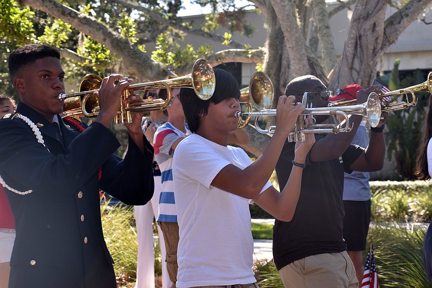 The Booker High School Marching Band performed throughout the parade route.