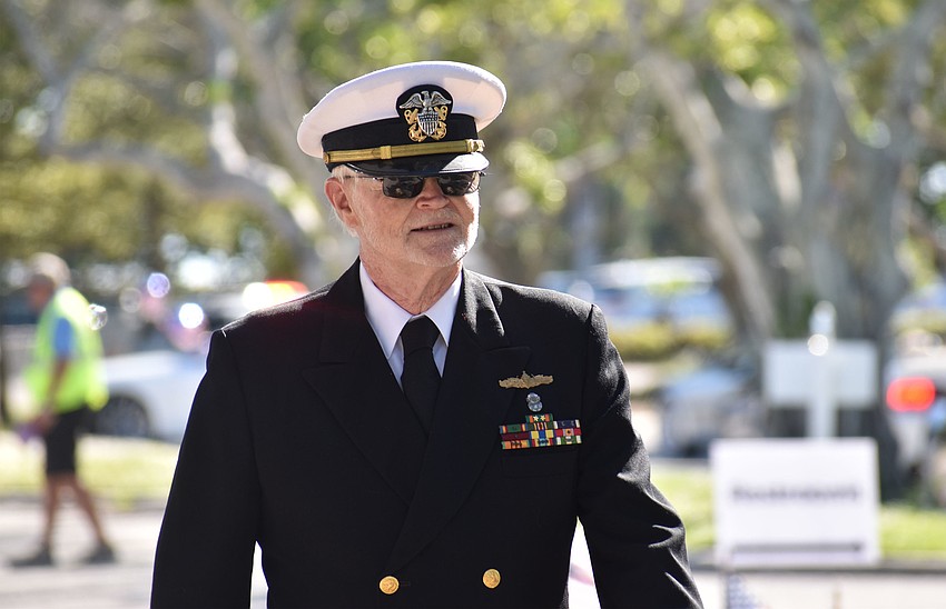 Ed Burton walks the quarter-mile parade route.