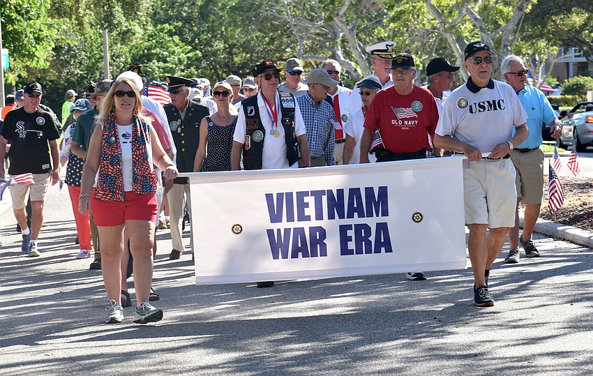 Vietnam War veterans march the parade route.