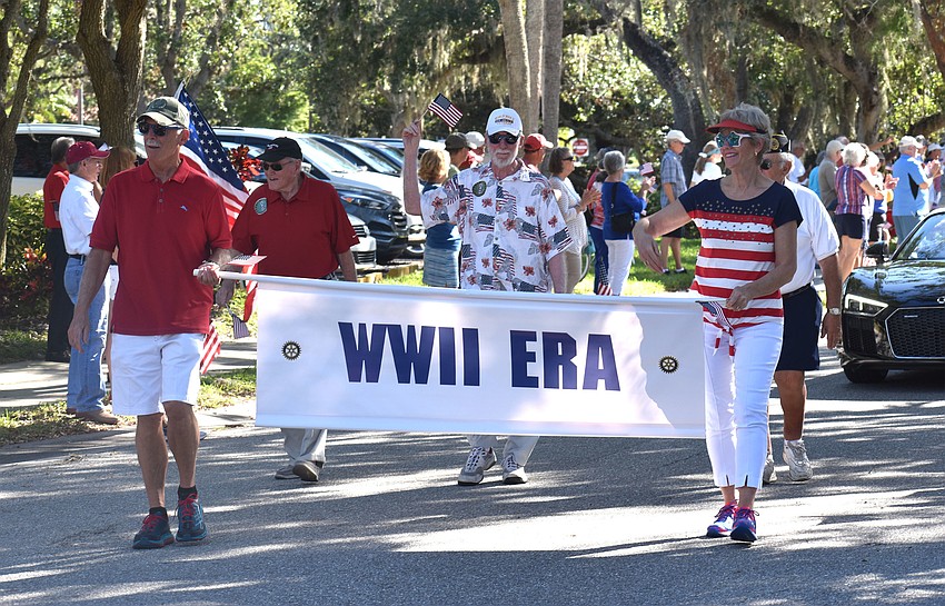World War II veterans march the parade route.