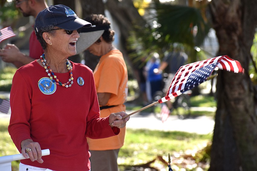 Sue Wertman waves to friends during the parade.
