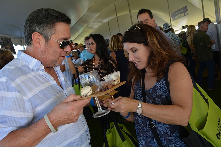 Tom Magliula and Robyn Erhardt, of Lakewood Ranch, sample tiramisu and other desserts.