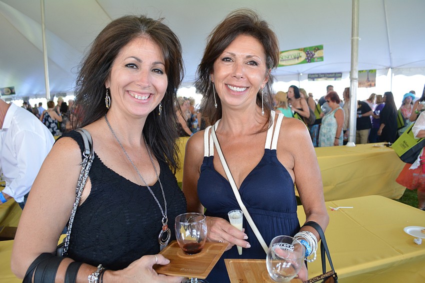 Wine Fest veteran Joan Fernandes, of Ellenton, brings her friend Lisa Butterick, of East County.