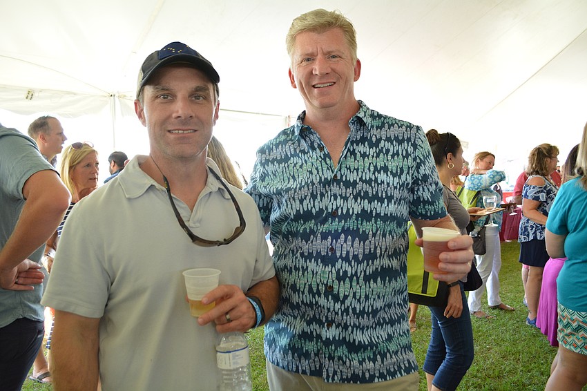 Brian Ehrlich and Mike Huyck, of Sarasota, focus on craft beer samples.