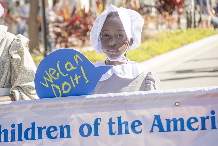Lanaeya Richardson marches in Sarasota's Veterans Day Parade.