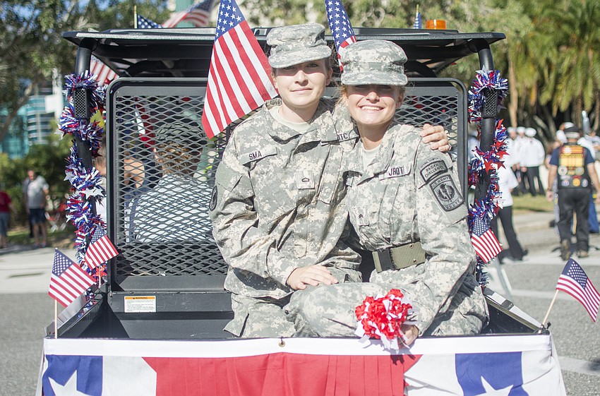 Sarasota Military Academy students Carlie Murphy and Juliana Rendle wait for the parade to begin at the corner of Osprey Avenue and Main Street