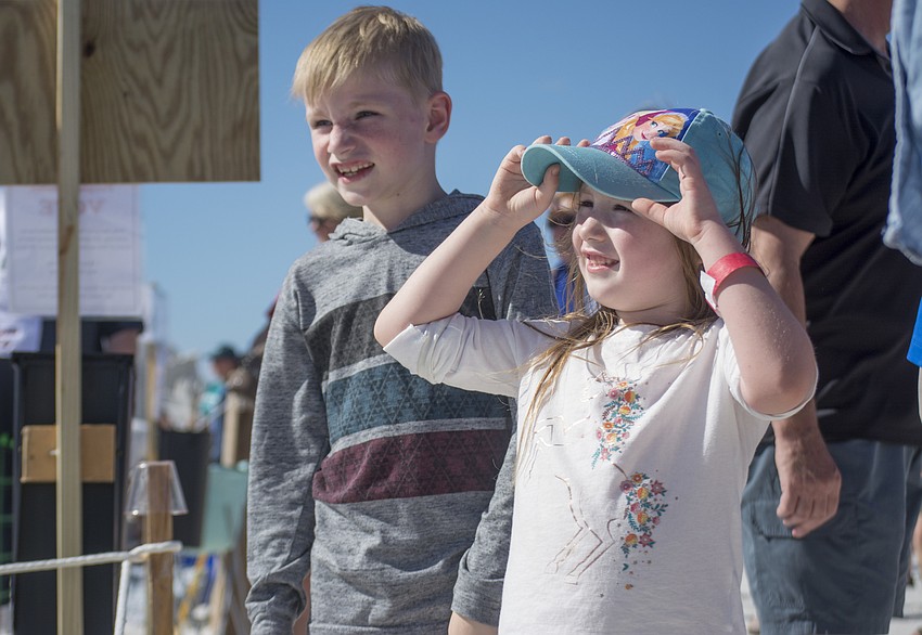 Jack and Lily Bennett watch as Marielle Hessels and Sue McGrew  work on their submission to the 2017 Crystal Classic.