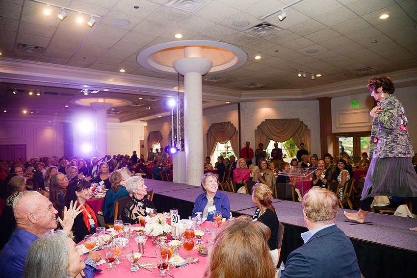 Guests enjoy the fashion show portion of the afternoon.