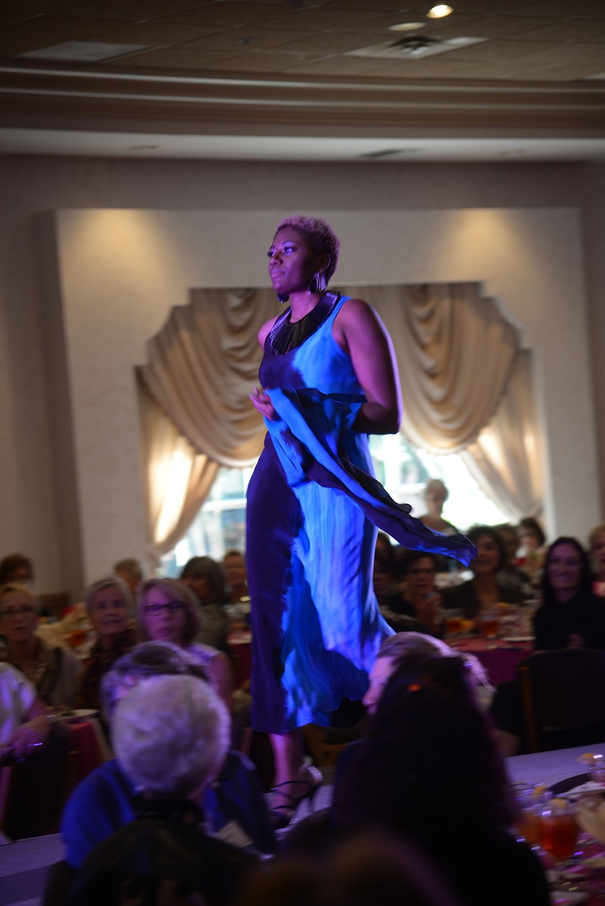 A model walks in the runway show.