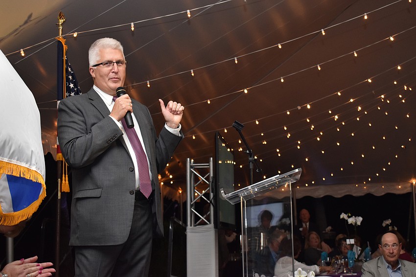 Chairman Michael Scott welcomes guests.