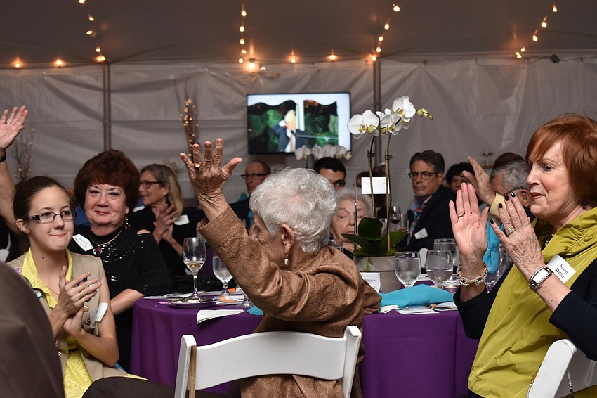 Residents raise their hands to show their Aviva pride.