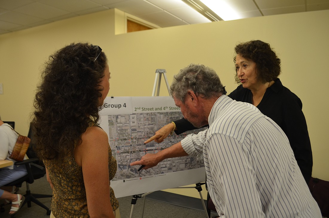 Dasha Pierce, Roger Barry and Phyllis Barry discuss potential changes to make Second Street and Fourth Street more bike-friendly.