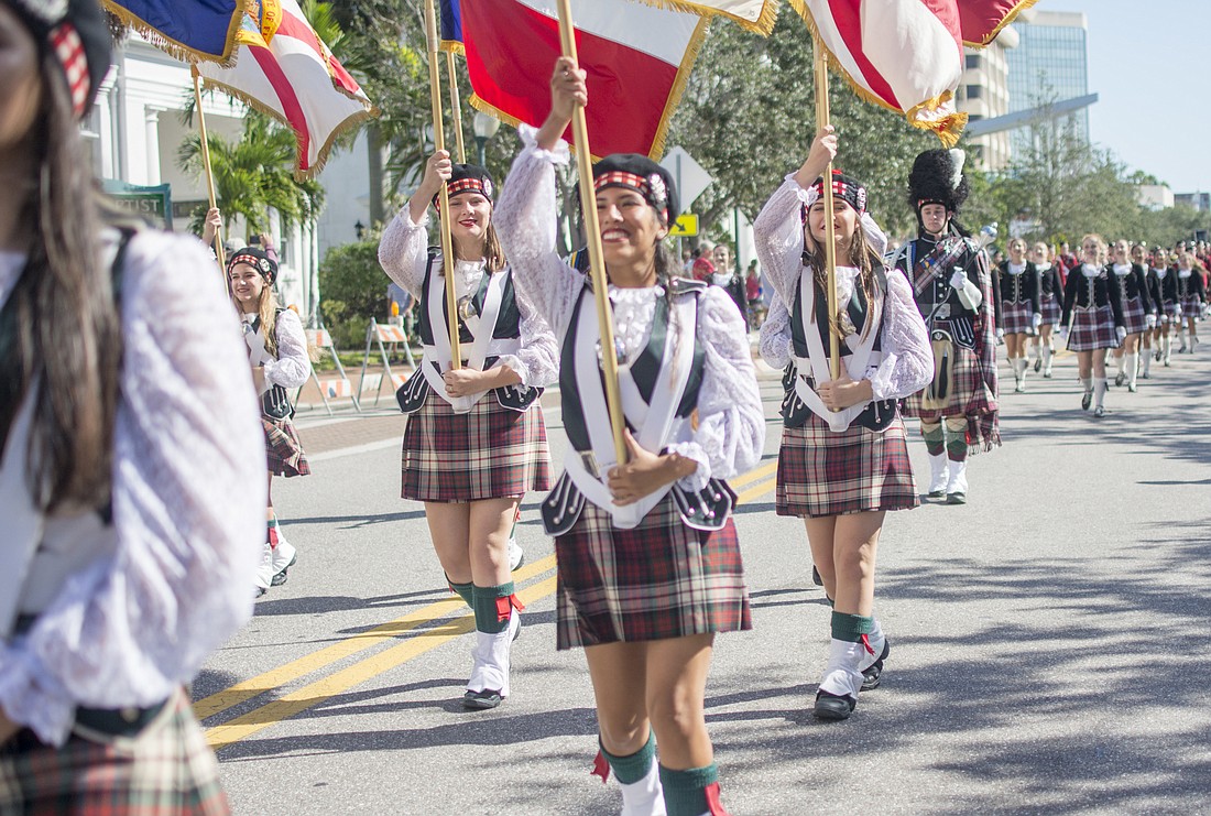 The Riverview Kilties march in the Sarasota Veterans Day Parade. The band will travel to Chicago to participate in the cityâ€™s Thanksgiving Day Parade.